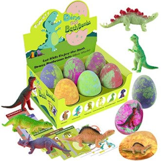 Colorful dinosaur bath bombs with toy dinosaurs and cards.