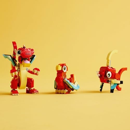 Three colorful LEGO dragon figures on a yellow background.