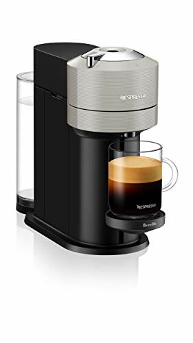 Nespresso coffee machine with a glass of espresso