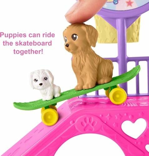 Toy puppies on a skateboard with a finger pressing down.